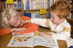 school kids reading book LRC